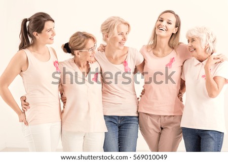 Group of positive women from anticancer foundation hugging together