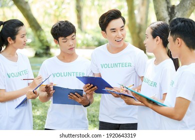 Group Of Positive Young Vietnamese Volunteers Meeting In Park To Discussis How To Attract New People In Their Organization