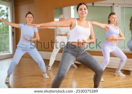 Group are practising arch movement in step jazz dance in fitness-gym
