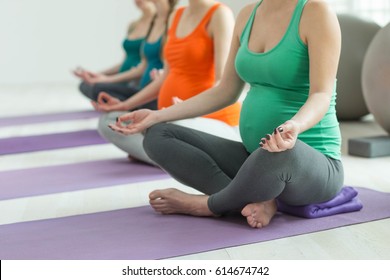 Group Of Pregnant Woman Doing Yoga 