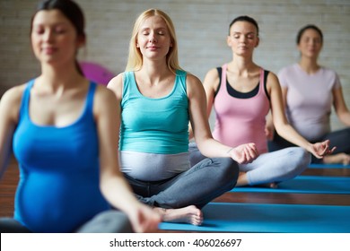 Group of pregnant women doing yoga