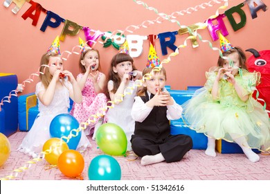 Group Of Preschool Kids With The Party Horns