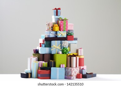 Group of presents. Gift boxes with origami bows. grey background.  