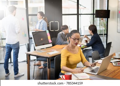 Group of professional business people working and communicating together in creative and modern office. Active teamwork. startup business people group working everyday job at modern office. - Shutterstock ID 785344159