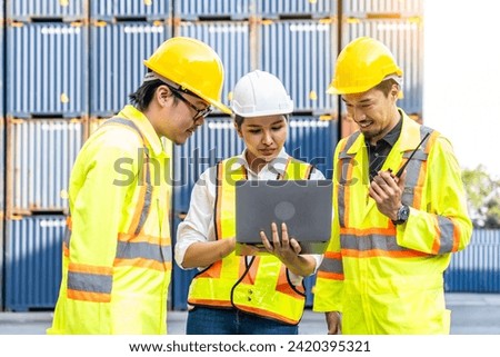 Group of professional dock worker and engineering people taking with their supervisor while record data online with digital laptop at warehouse logistic in cargo freight ship for import and export