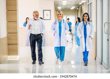 Group Of Professional Medical Doctor Team With Stethoscope In Uniform Working Discussing And Talk Walking In Hospital.health Medical Care Concept