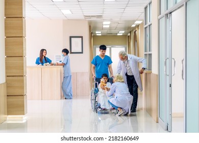 Group Of Professional Medical Doctor Team Work With Stethoscope In Uniform Working Discussing And Talk With Sick Patient Walking In Hospital.health Medical Care Concept