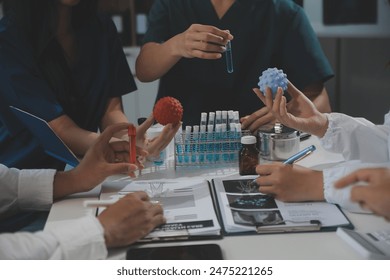 Group of professional medical doctor team meeting training medical in uniform working discussing and talk with patients record, teaching medic team, sit in hospital.health medical care concept - Powered by Shutterstock