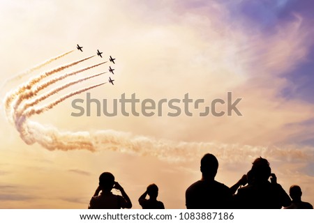 A group of professional pilots of military aircraft shows tricks in the evening sky, leaving beautiful traces of clouds. International Aviation and Space Salon, MAKS. Zhukovsky, Moscow Region, Russia.