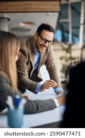 Group of professionals collaborating in an office setting for business planning.