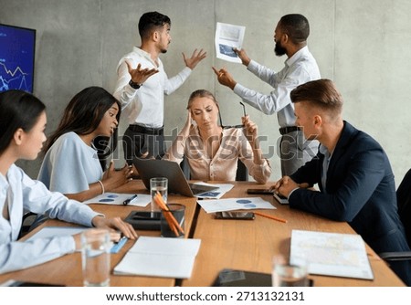 Group of Professionals Debating During Corporate Meeting in Modern Boardroom Setting