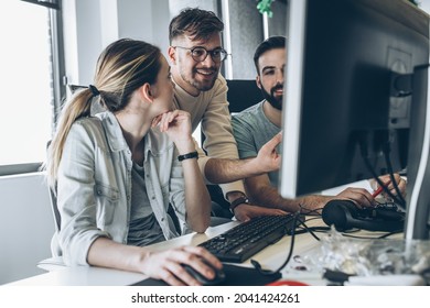 Group of programmers and software developers working on a new project at the office.	 - Shutterstock ID 2041424261