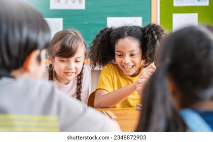 Group of pupil boy girl group study with teacher in classroom at elementary school. Student in primary school story telling. Children  classroom. Education knowledge, success teamwork concept banner - Powered by Shutterstock