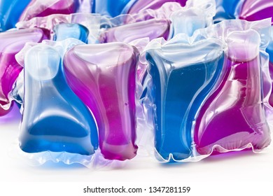 Group Of Purple And Blue Laundry Detergent Pods, Isolated On White Limbo Background