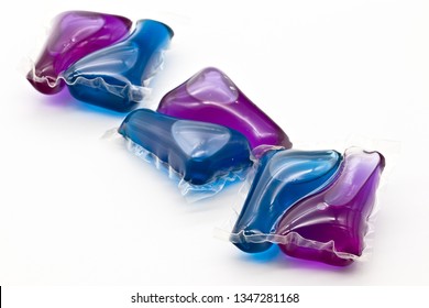 Group Of Purple And Blue Laundry Detergent Pods, Isolated On White Limbo Background