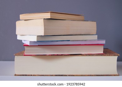 group of reading books on grey background on the table