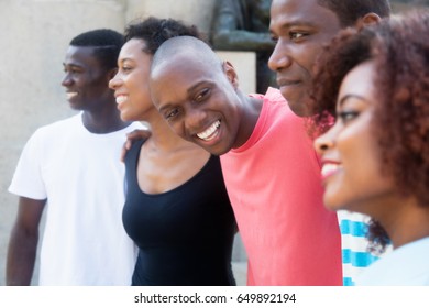 Group Of Relaxing African American Men And Women