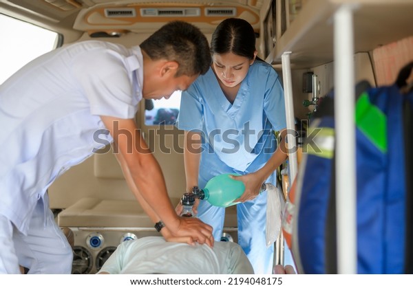 Group of rescue emergency team\
transporting patient from Emergency car  through Hospital\
Corridors. cardio pulmonary resuscitation on an unconscious patient\
.