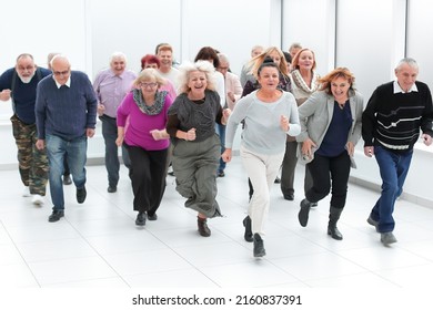 A Group Of Retirees Are Running For Retirement. Group Of Older People