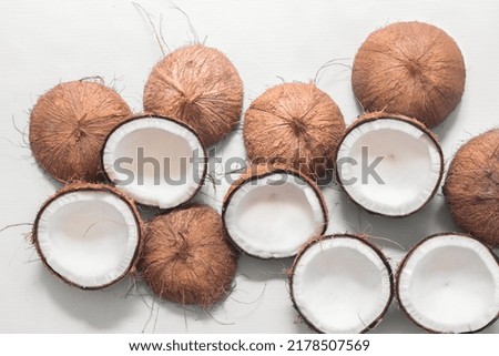 A group of ripe coconuts (halves) ready to make coconut milk and coconut flakes. Isolated on a white background. Top view. Healthy food. Agriculture concept. 