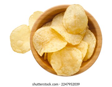 Group of round natural potato chips in a wooden bowl, isolated on white background