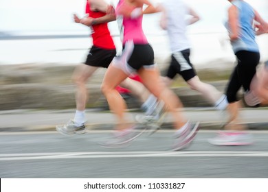 Group Of Runners Compete In The Race, Blurred Motion