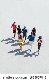 Group Of Runners Running. Top View And Rear View.