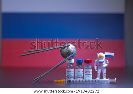 Group of russian vaccines named after a well-known russian satellite against Covid 19 virus with syringe and small astronaut. With russian flag. Tag text reads, corona virus injection only.