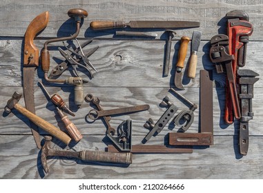 Group of rustic antique tools with small space for copy