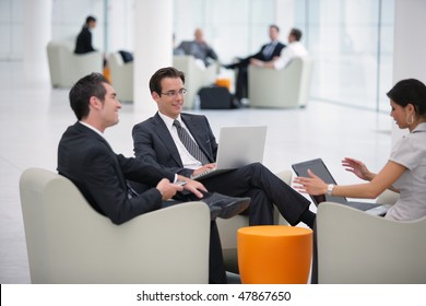 Group Of Sales People Working With Laptop Computer At A Seminar