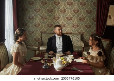 Group scene at dining table featuring three elegantly dressed figures conversing in classical interior