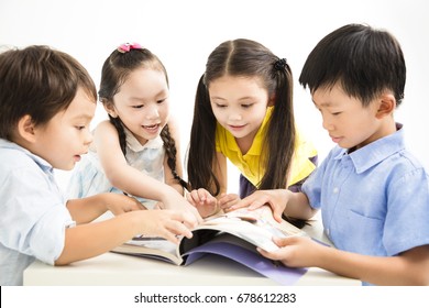 Group Of School Kids Studying Together