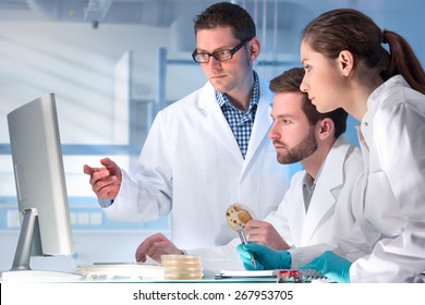 group of scientists working at the laboratory - Powered by Shutterstock