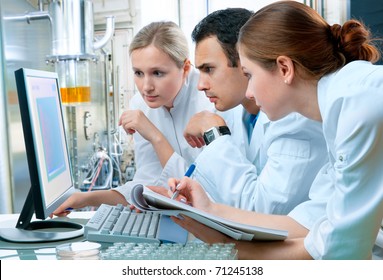 group of scientists working at the laboratory