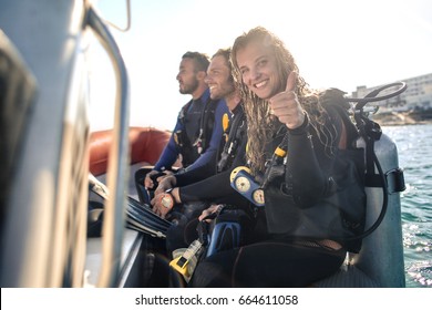 Group Of Scuba Divers On A Boat