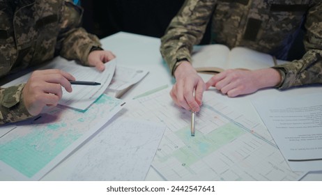 Group of security squad in control center. Military headquarters surveillance officers cyber police briefing at the table in office, close up shot.