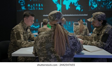 Group of security squad in control center. Military headquarters surveillance officers cyber police briefing at the table in office, checking paper documents.