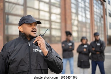 Group Of Security Staff At Event. African Bodyguard Officers