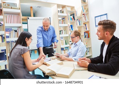 Group At Seminar For Adult Education With Lecturer In Seminar Room