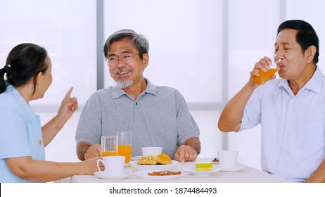 Group Of Senior Friends Enjoying Eating On Dining Table