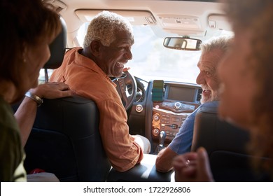 Group Of Senior Friends Enjoying Road Trip In Car Together - Powered by Shutterstock