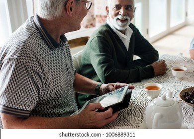 Group of senior friends hanging out together - Shutterstock ID 1006889311