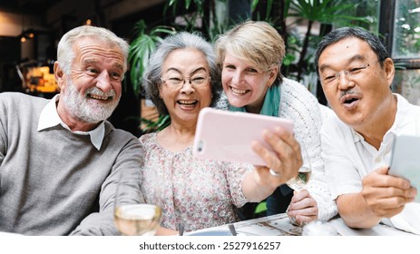 Group of senior friends selfie, smile and happy. Smiling diverse senior friends take selfie photo. Happy senior friends have fun time, diverse group selfie together, diverse senior friends selfie - Powered by Shutterstock