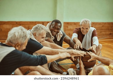 Group of senior men in indoor basketball gym - Powered by Shutterstock