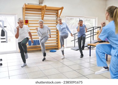 Group of senior people dancing and working out in fitness class of nursing home with female caregiver - Powered by Shutterstock