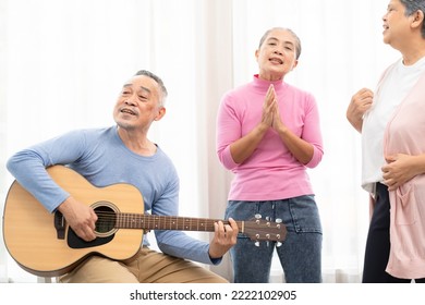 Group Of Senior People Enjoying With Activities Together. Elderly People Having Fun Concept. Happy Senior Playing Guitar And Singing Songs Having Fun Together.