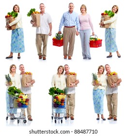 Group Of Senior People Holding Shopping Bag With Food Products. Isolated Over White Background.