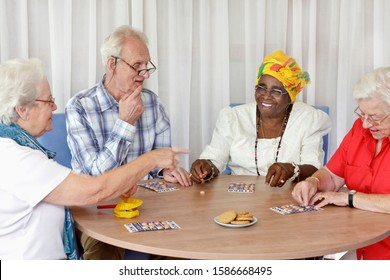 A Group Of Senior People Playing Bingo Together