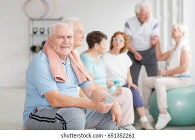 Group Of Senior People Relaxing After Workout In A Gym