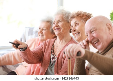 Group Of Senior People Spending Time Together In Nursing Home